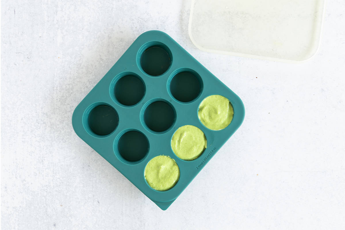 Broccoli pasta sauce in silicone freezer storage.