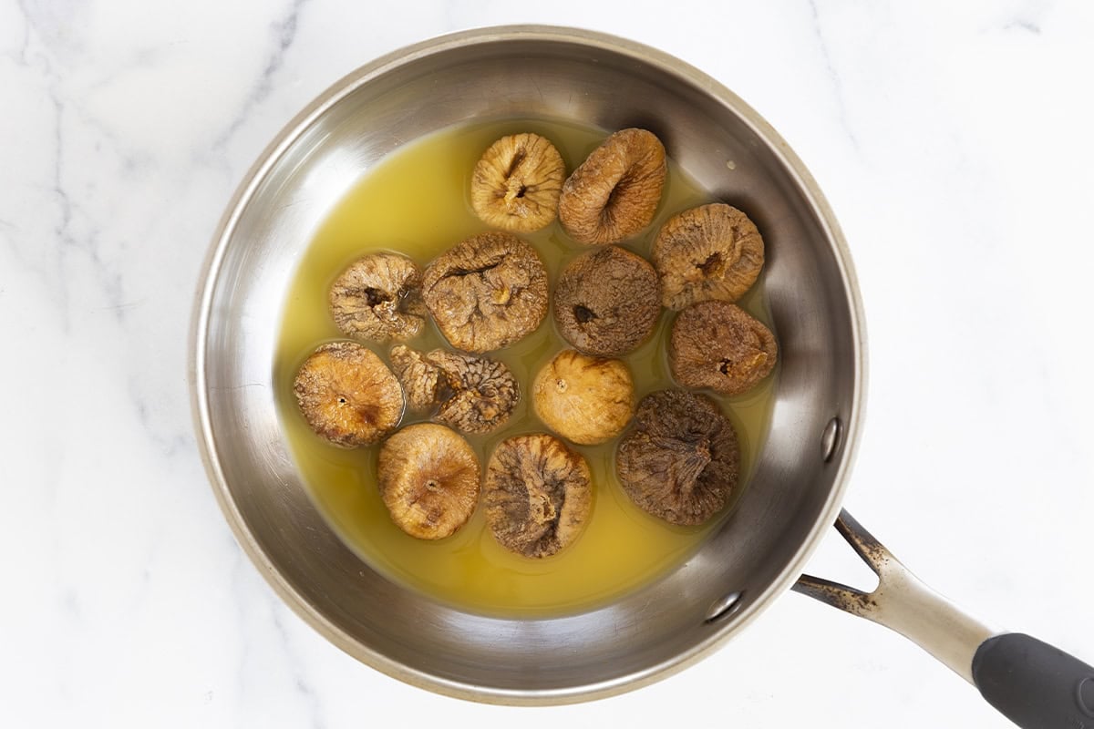 Figs in juice in a sauce pan for fig bars.