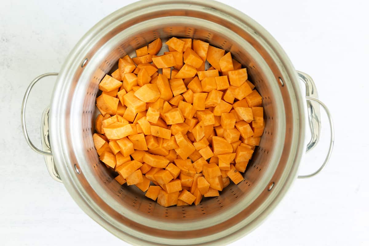 diced sweet potato in pot to steam.
