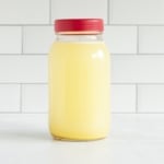 Turkey broth in glass jar with lid.