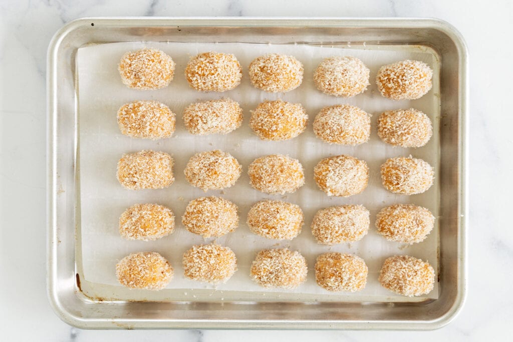 formed chicken nuggets on baking tray.