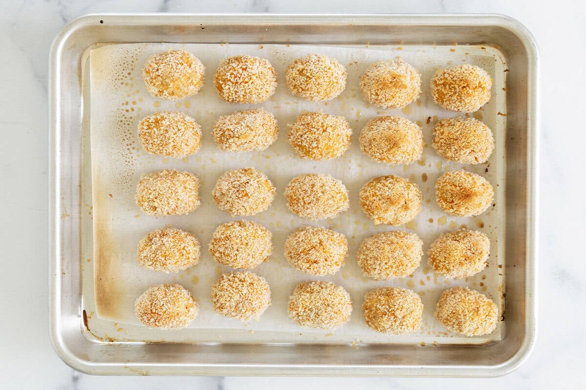 baked homemade chicken nuggets on pan.
