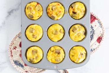 Sausage egg muffins after baking in muffin tin.
