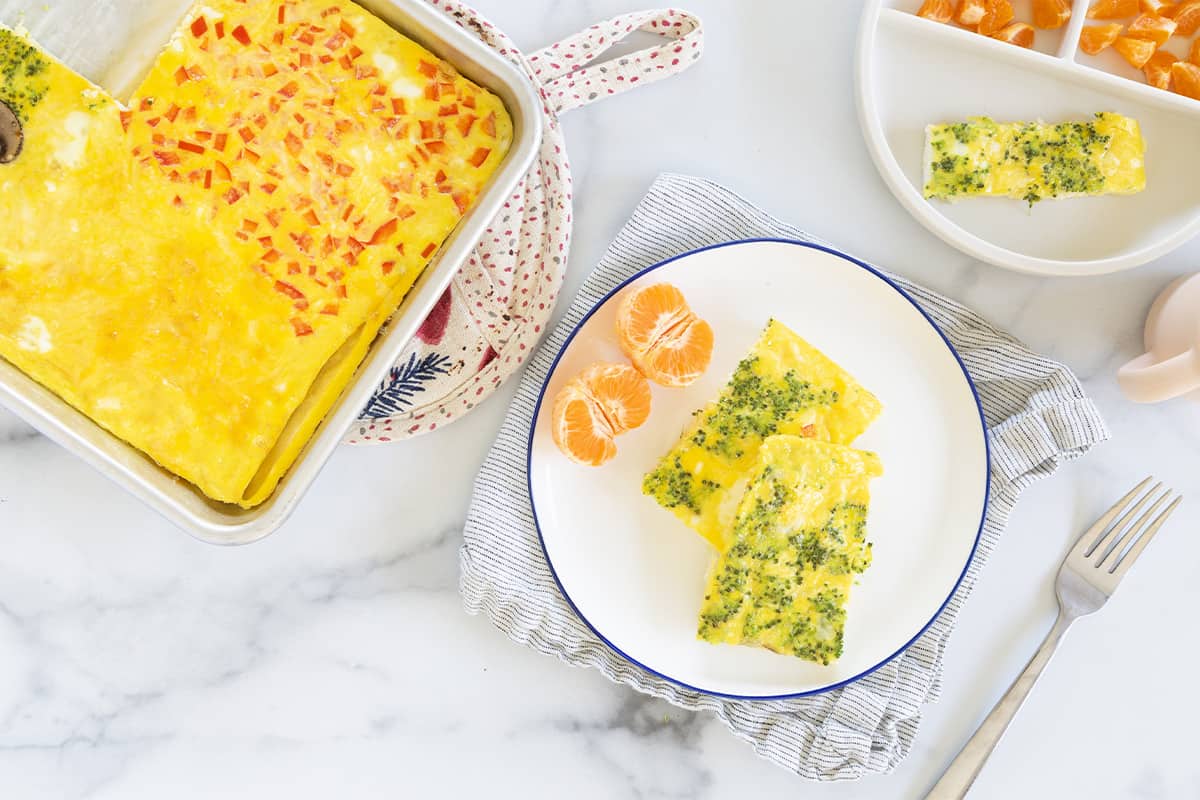 Sheet pan eggs on plate and in pan. 