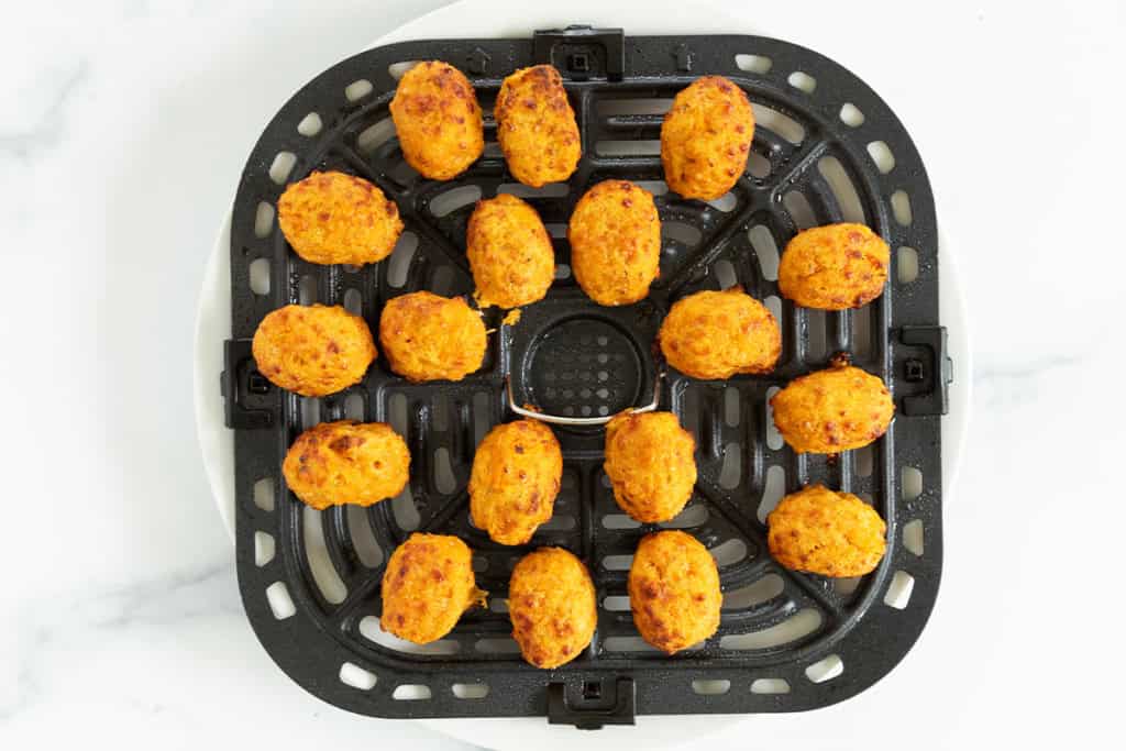 sweet potato tots on air fryer pan.