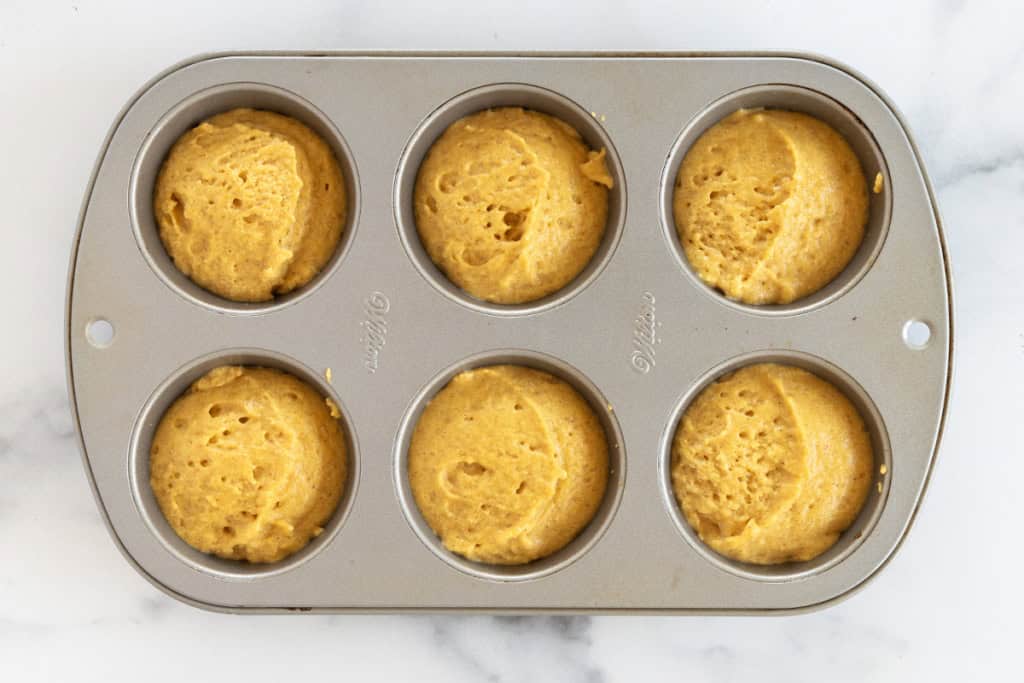 Pumpkin muffins in pan before baking.