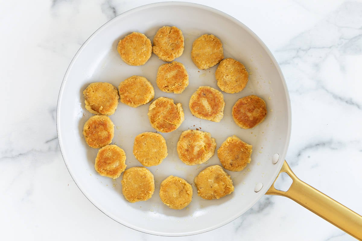 Chickpea fritters in frying pan.