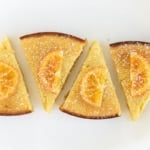 Olive oil cake slices on white plate.