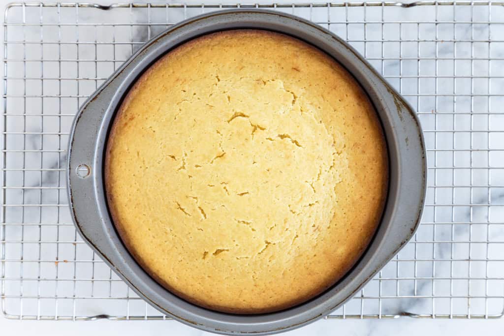 Olive oil cake on cooling rack after baking.