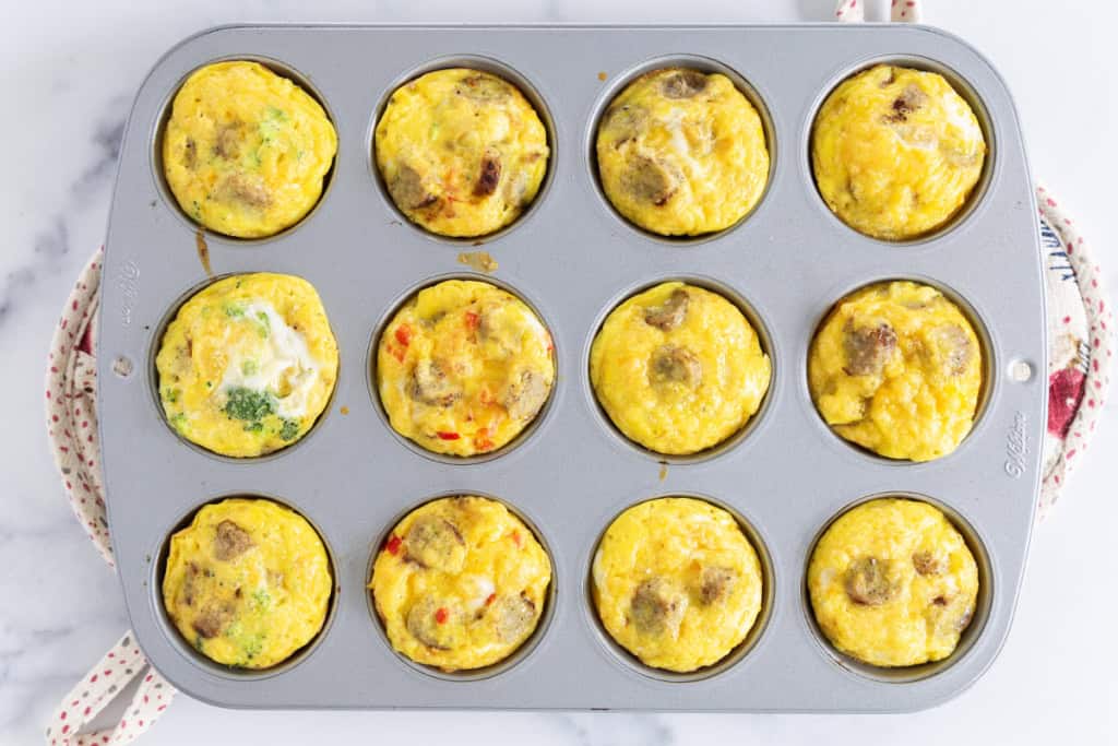Sausage egg muffins in muffin pan after baking.