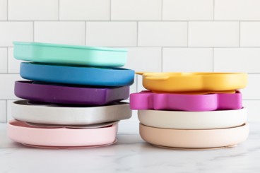 Silicone plates stacked on counter.