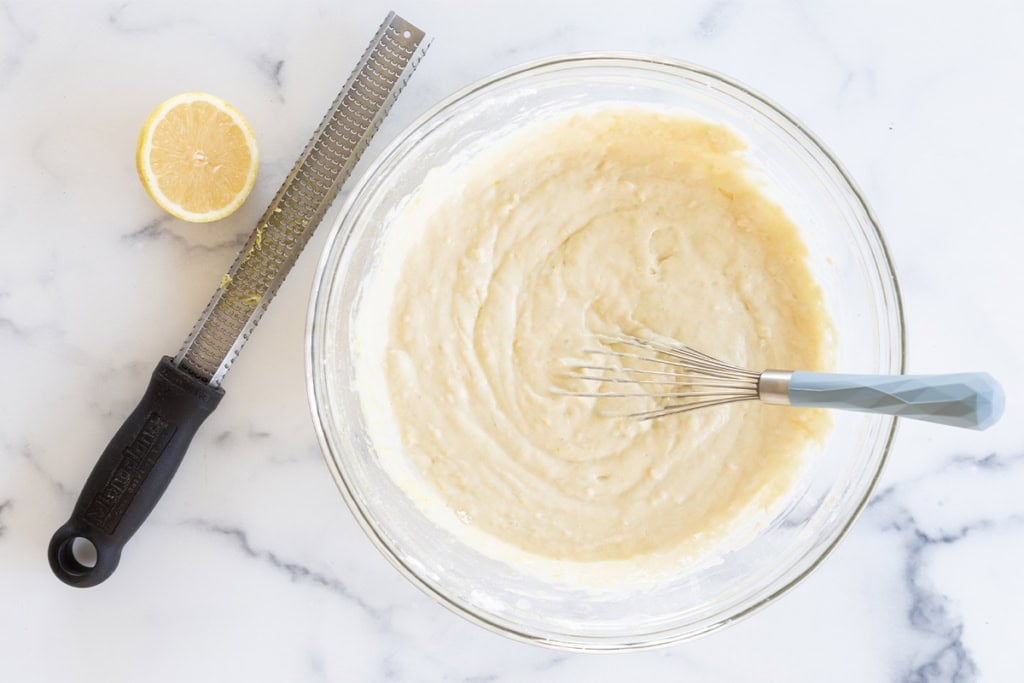 Batter for yogurt snack cake in glass bowl.