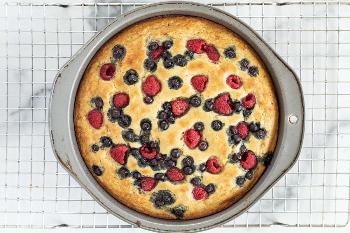 baked breakfast cake in pan on wire rack.