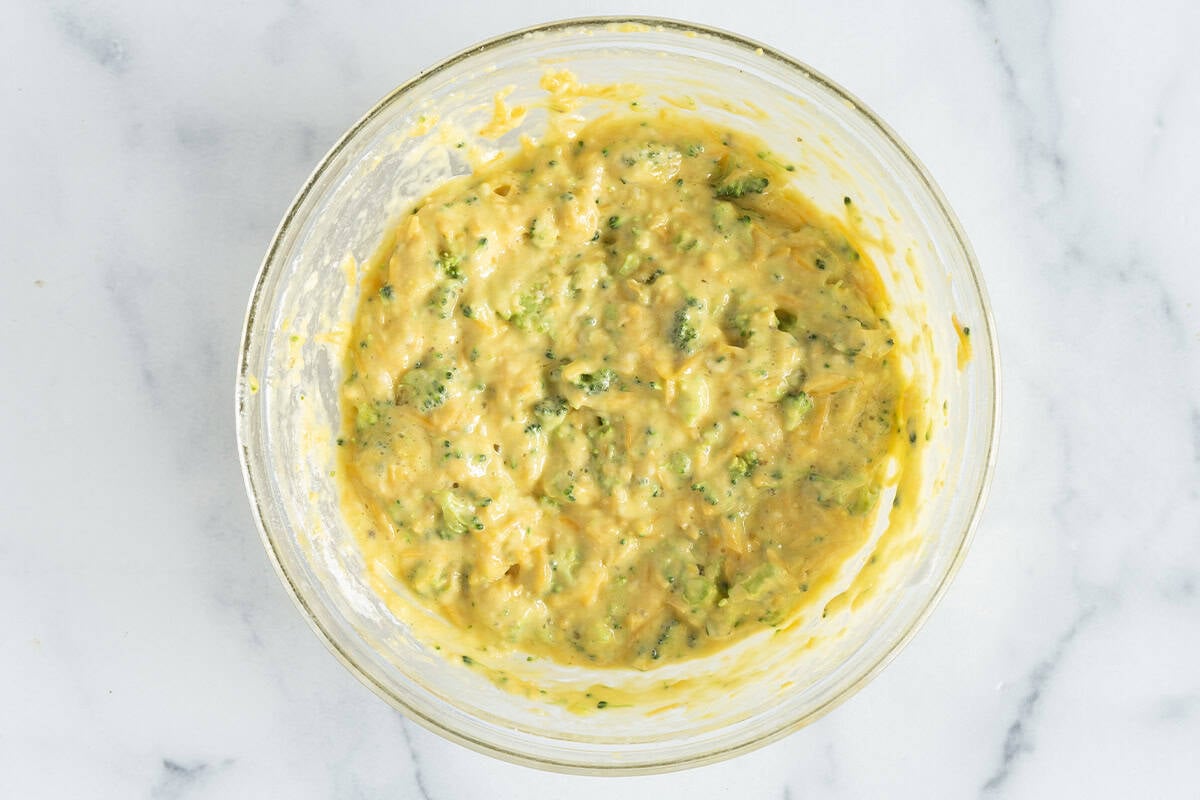 Mixture for broccoli egg bake in glass bowl.