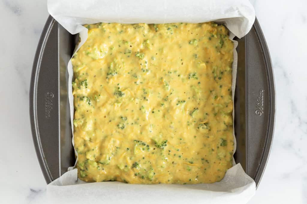 Broccoli egg bake in pan before baking.