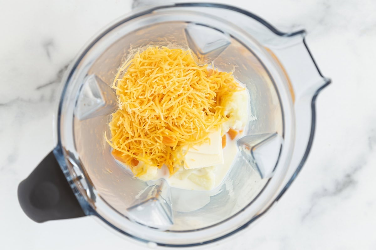 Ingredients for hidden veggie mac and cheese sauce in blender.
