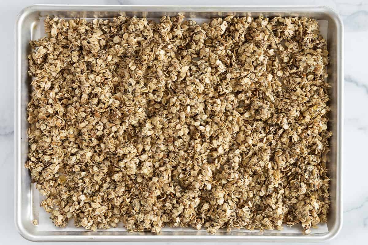 Nut free granola on baking sheet before baking.