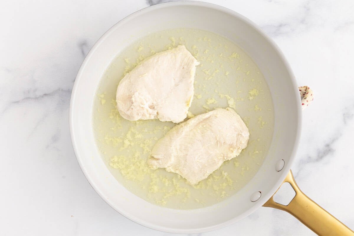 Cooked chicken in pan for chicken for baby.