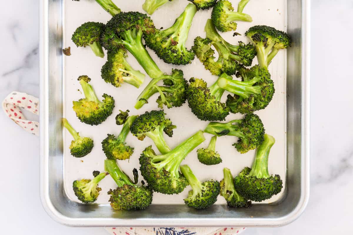 Roasted broccoli on sheet pan.