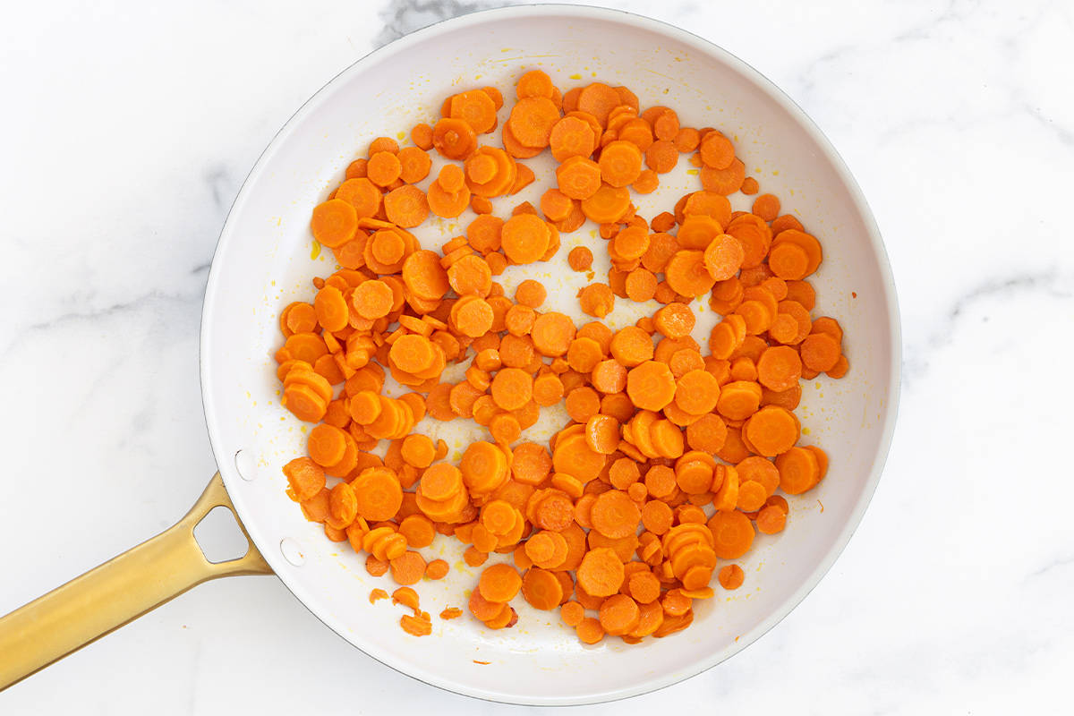 sauteed carrots in pan.