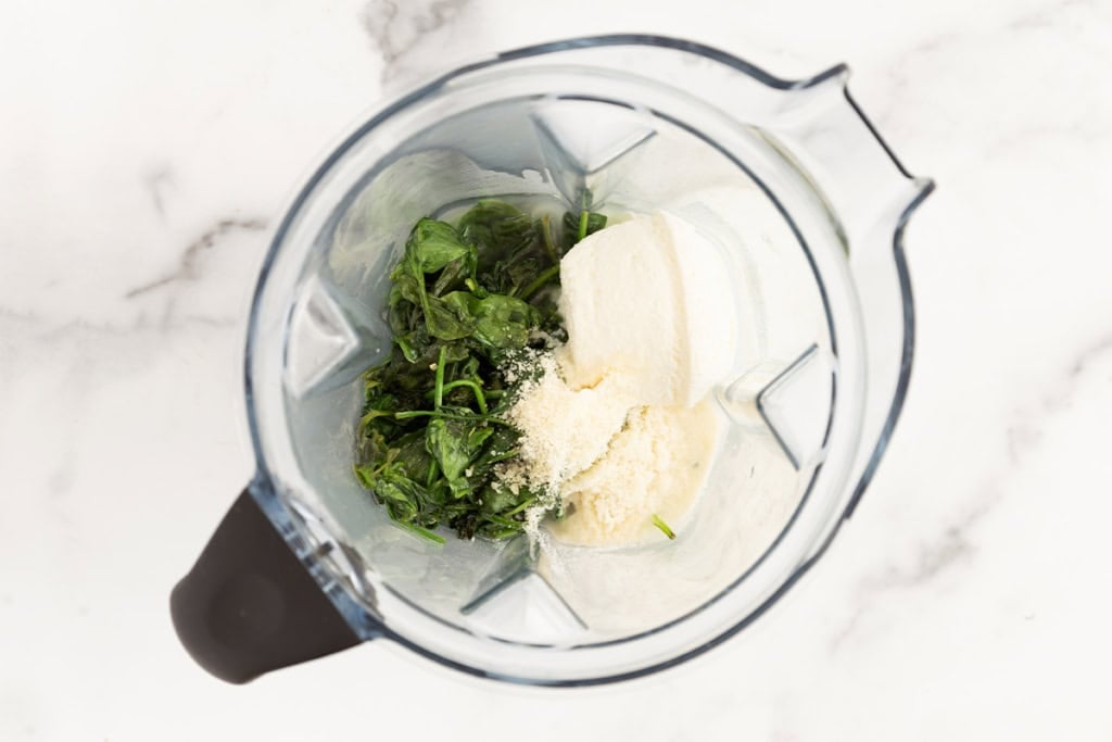 Ingredients for spinach pasta sauce in blender.