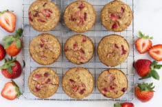 healthy strawberry muffins on cooling rack.