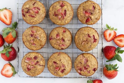 healthy strawberry muffins on cooling rack.