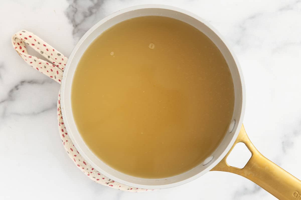 Broth in pan for tortellini in broth. 