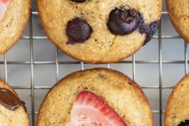 Berry muffins on cooling rack.