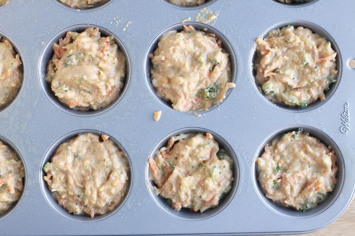 veggie muffin batter in muffin tin.
