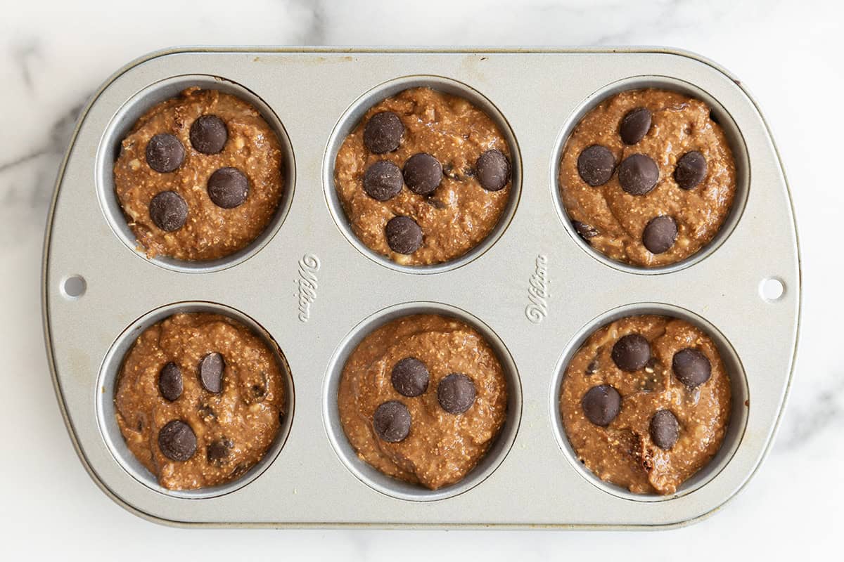 Chocolate peanut butter muffins in muffin pan before baking. 