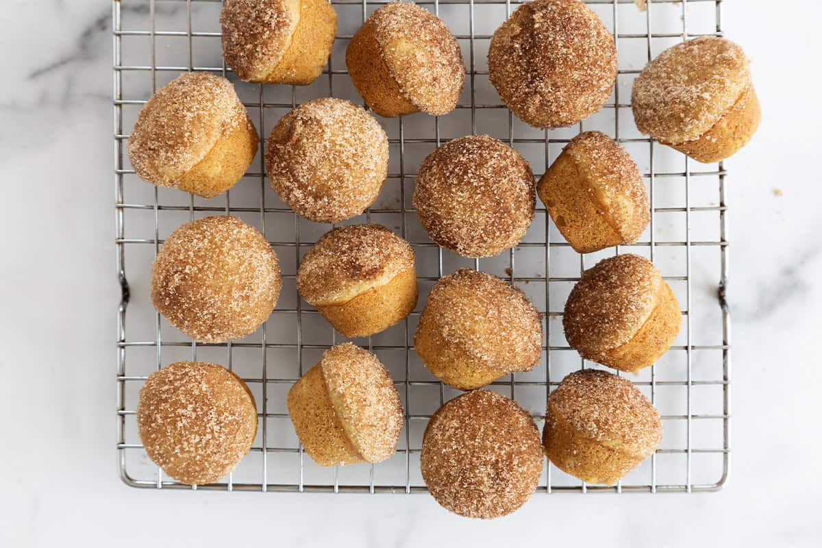 mini donut muffins on wire rack.