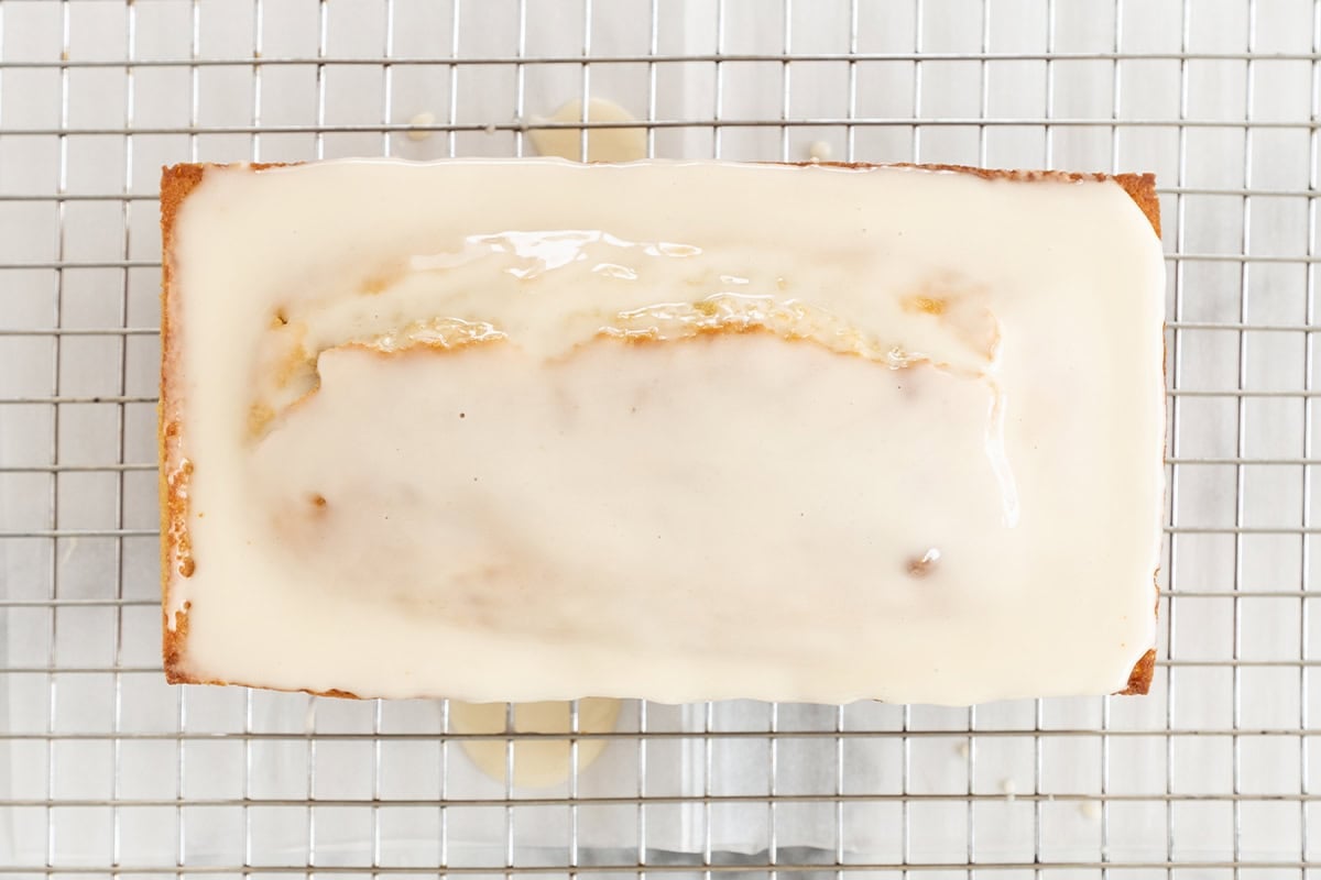 iced lemon yogurt cake on wire rack.