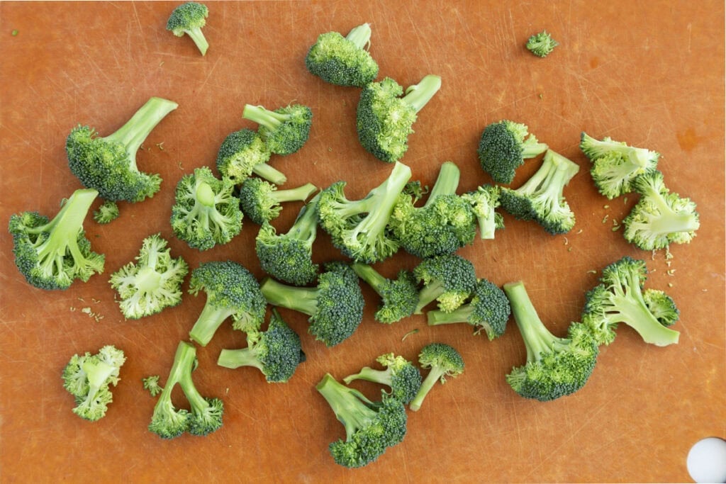 broccoli florets on cutting board.