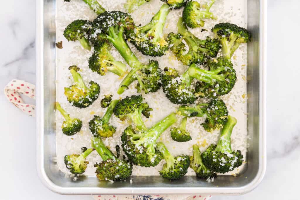 roasted broccoli on pan with parmesan.