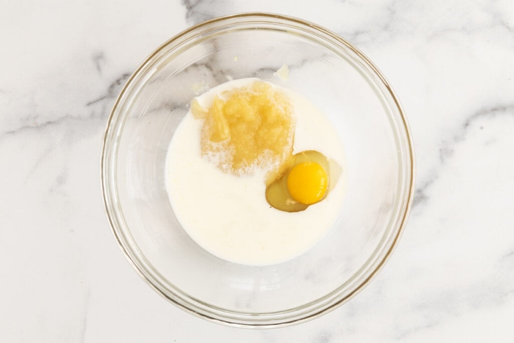 wet ingredients for donut muffins in glass bowl.
