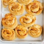 Pizza pinwheels on baking sheet after baking.