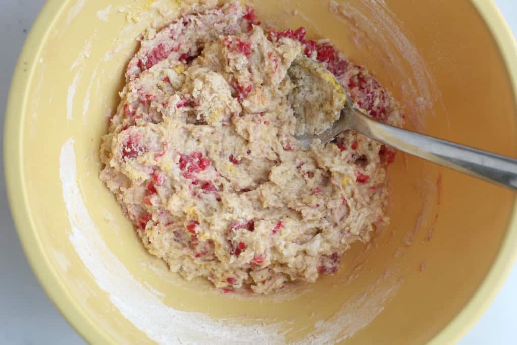 Batter for raspberry donuts in yellow bowl.