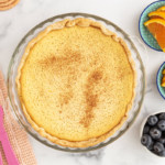 Ricotta pie with sides of fruit.