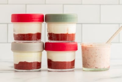 strawberry yogurt in jars on counter.