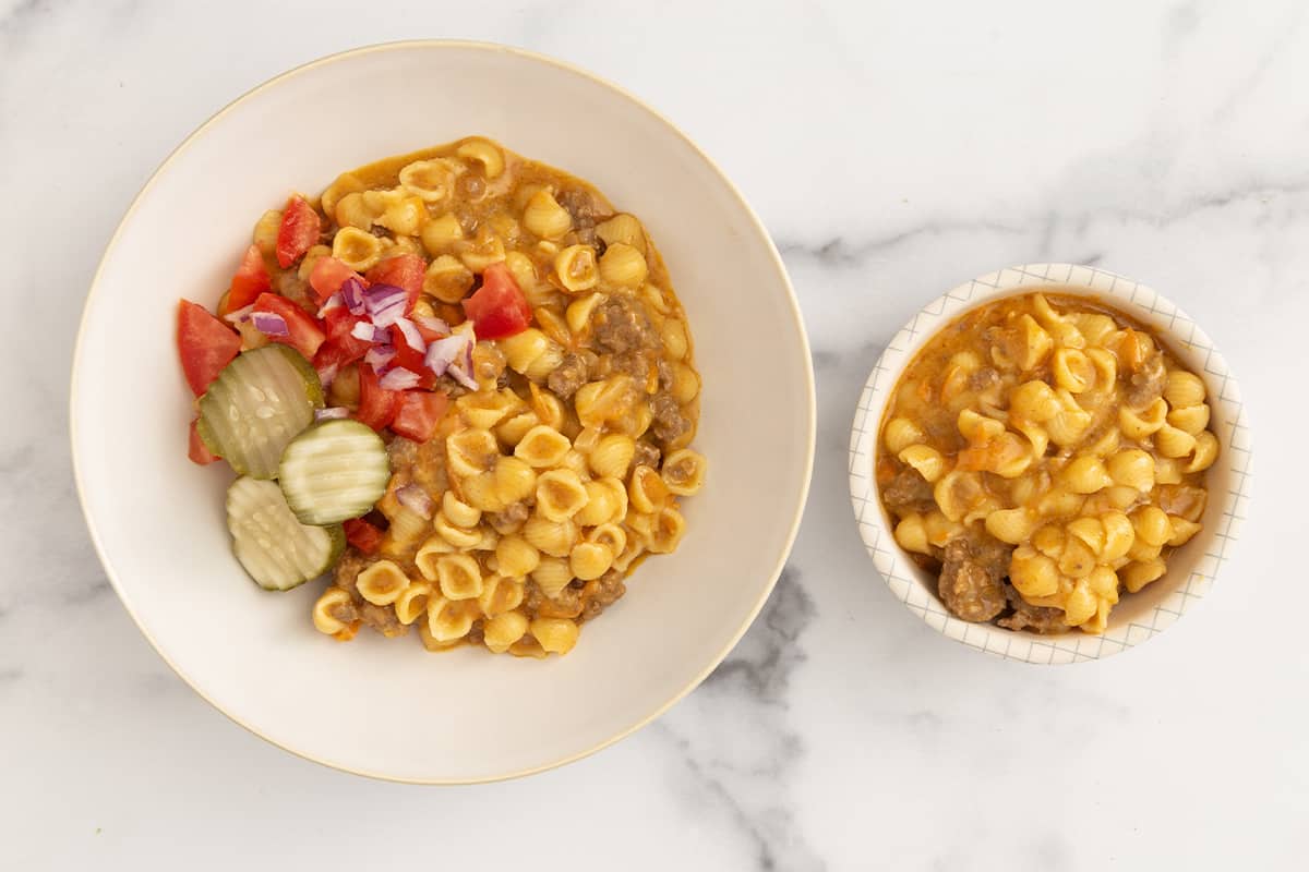 Cheeseburger pasta in two white bowls.