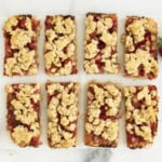 Strawberry oatmeal bars cut into rectangle pieces.