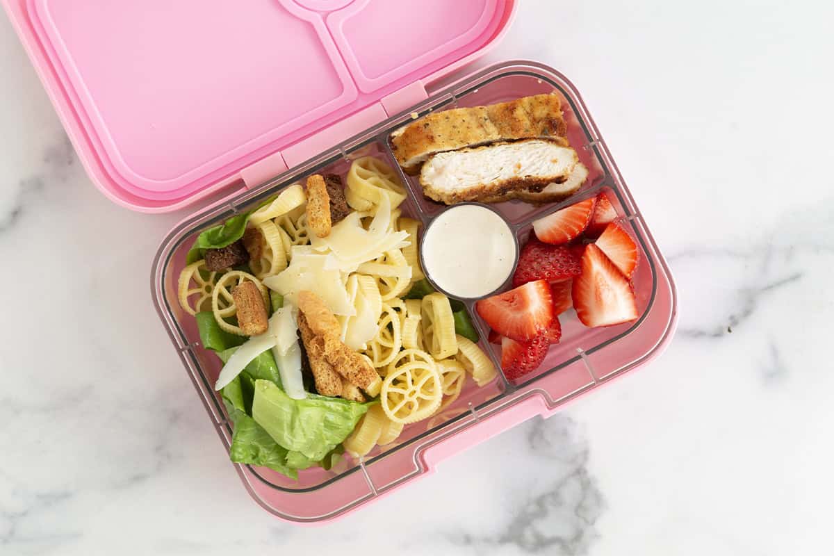 chicken caesar pasta salad in pink yumbox.