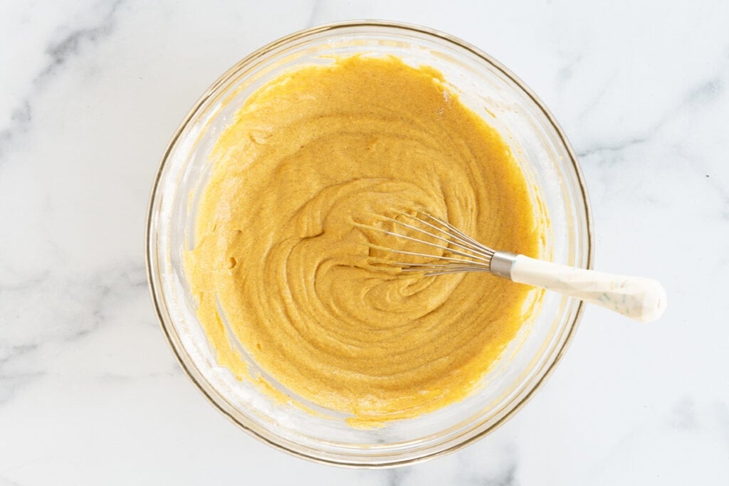 batter for pumpkin cupcakes in glass bowl.