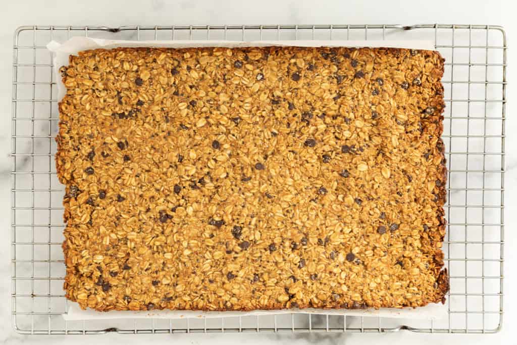 peanut butter granola bars cooling on a wire rack.