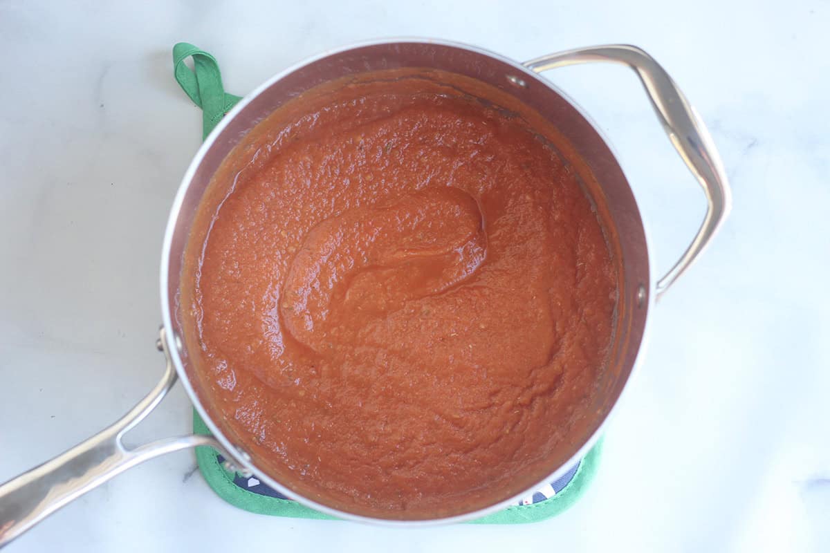 warmed baby pasta sauce in pot.