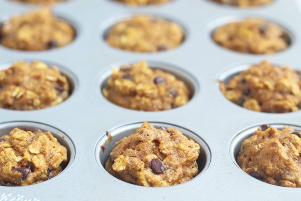 Pumpkin chocolate chip muffins in pan.