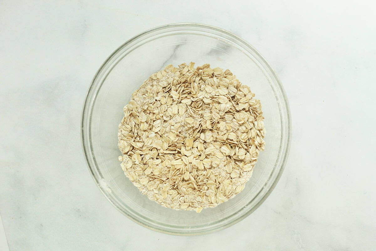 Oats in a glass bowl for pumpkin chocolate chip muffins. 