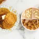 Pumpkin protein pancakes on two plates with sides.