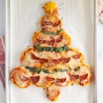 Christmas pizza on baking sheet.